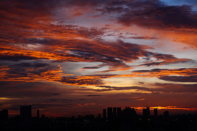 Silhouette landscape against scenic sky