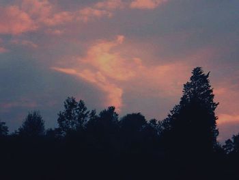 Silhouette of tree against cloudy sky