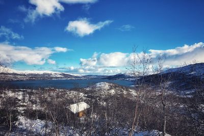 Scenic view of snowcapped mountains against sky