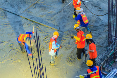 High angle view of people standing by rope