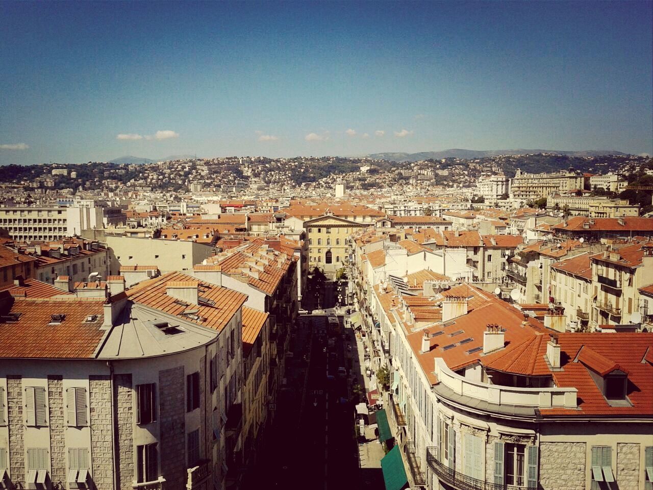 building exterior, architecture, built structure, high angle view, cityscape, city, residential district, crowded, residential structure, residential building, clear sky, house, roof, townscape, town, city life, copy space, community, street, old town