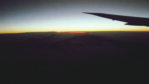 Scenic view of landscape against sky at sunset