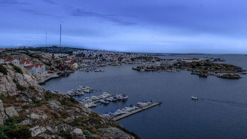 High angle view of marina by sea against sky