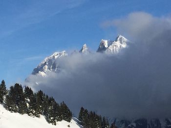 Scenic view of snow covered mountains