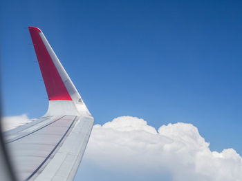 Airplane flying over blue sky