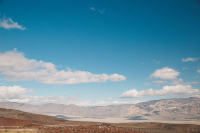 Scenic view of desert against blue sky