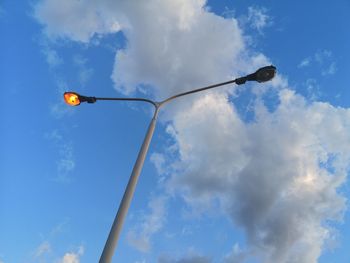 Low angle view of street light against sky