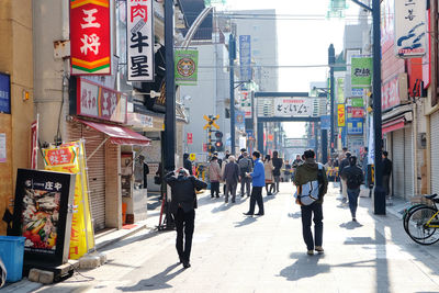 People walking on street in city