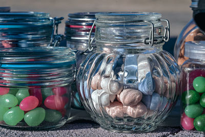 Close-up of candies in jar on table