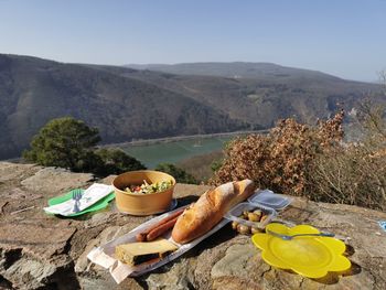 High angle view of breakfast on table against mountains