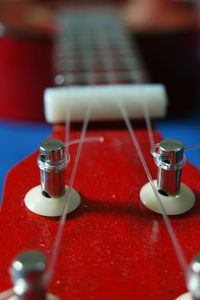 Close-up of guitar on table