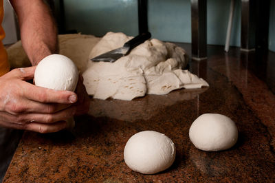 Midsection of man preparing food