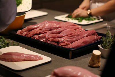 Close-up of meat in tray on table