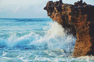 View of waves in sea against sky