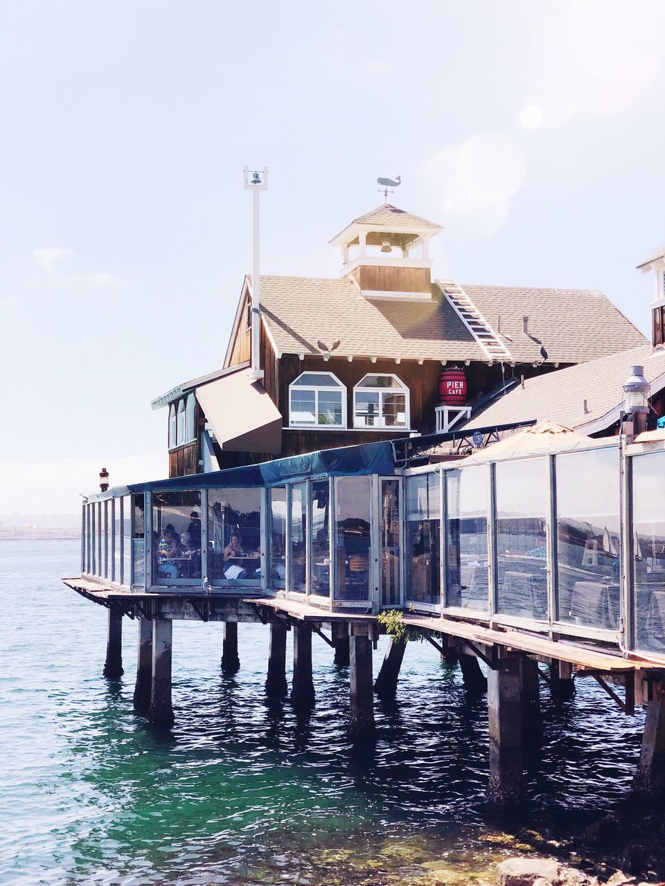 water, built structure, architecture, building exterior, waterfront, sky, building, house, nature, nautical vessel, sea, day, transportation, residential district, reflection, no people, stilt house, outdoors, mode of transportation, wooden post