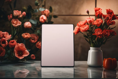 Midsection of woman using laptop on table