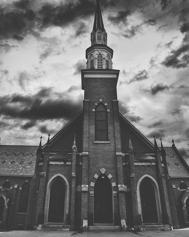 architecture, built structure, building exterior, sky, low angle view, cloud - sky, arch, cloudy, church, cloud, religion, history, place of worship, facade, outdoors, spirituality, day, travel destinations, old