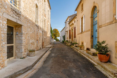 Empty alley amidst buildings