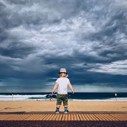 Little boy staring at storm