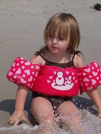 Girl sitting in water