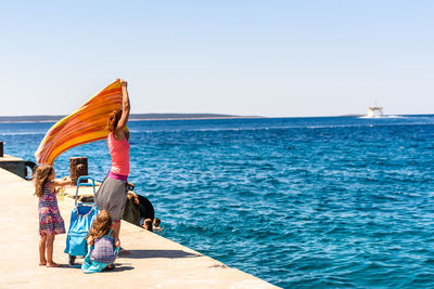 Family at beach in sunny day