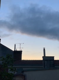 Low angle view of building against sky during sunset