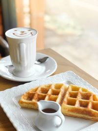 Close-up of coffee and cup on table