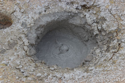 High angle view of hole on rock