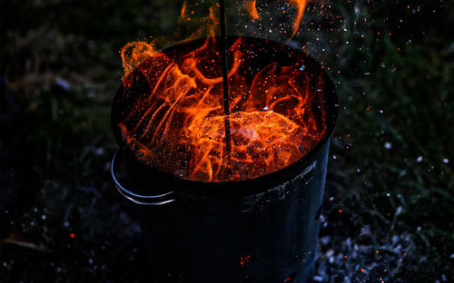 Close-up of fire in container