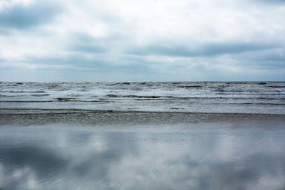 Scenic view of beach and sea against sky