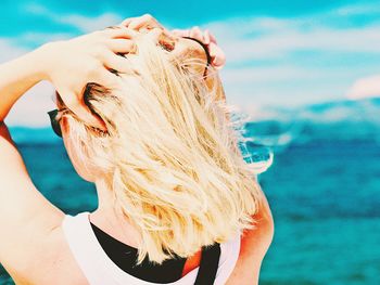 Portrait of woman in swimming pool at beach