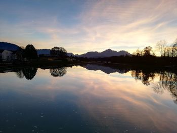 Scenic view of lake against sky during sunset
