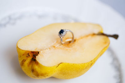 Close-up of lemon slice against white background