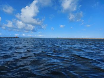 Scenic view of sea against blue sky