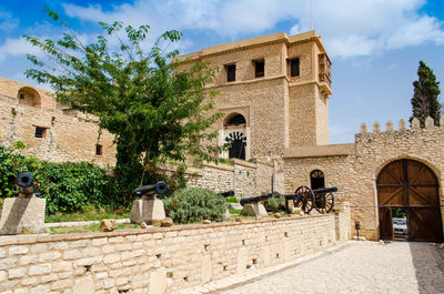 View of historical building against cloudy sky