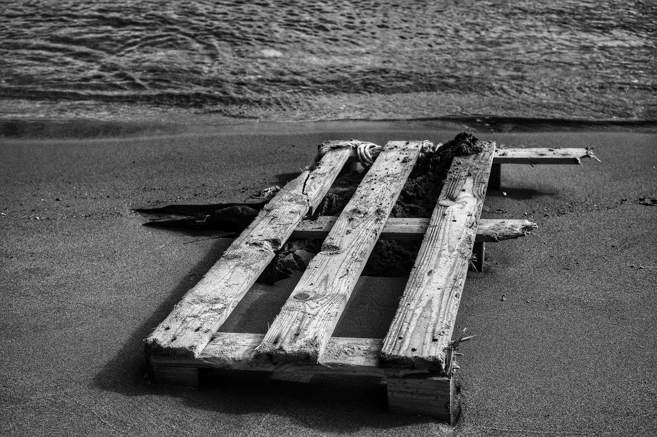 white, black, black and white, monochrome, monochrome photography, beach, water, high angle view, land, wood, no people, darkness, day, nature, sea, sand, transportation, outdoors, light, vehicle