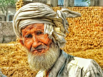 Portrait of senior man wearing turban on field