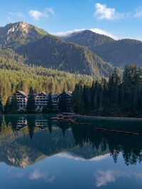 Scenic view of lake and mountains against sky