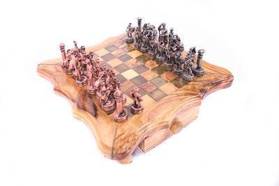 High angle view of chess on table against white background