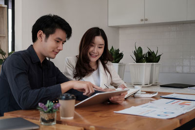 Female friends working at office