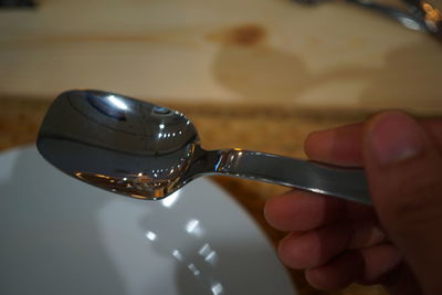 Close-up of hand holding ice cream