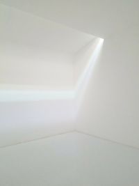 Sunlight falling on white wall at home