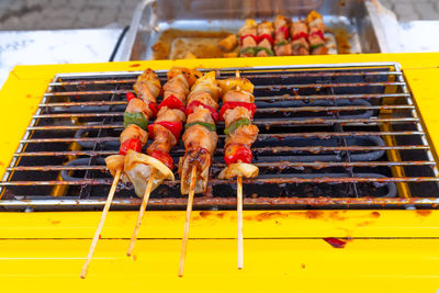 High angle view of meat on barbecue grill