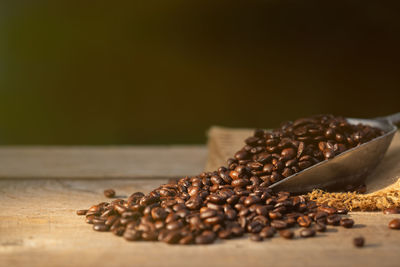 Close-up of roasted coffee beans on table