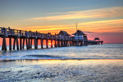 Scenic view of sea against orange sky