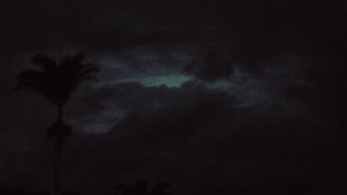 Low angle view of storm clouds at night