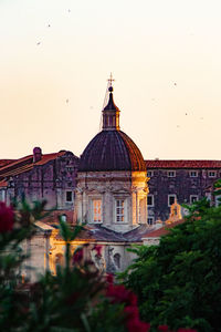 View of temple building against sky in city