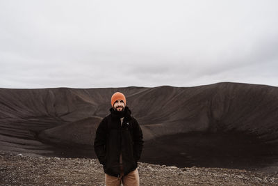 Rear view of man standing on mountain