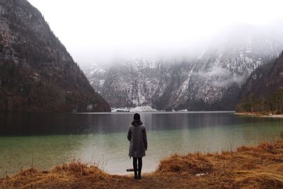 Man standing on lakeshore