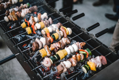 High angle view of meat on barbecue grill